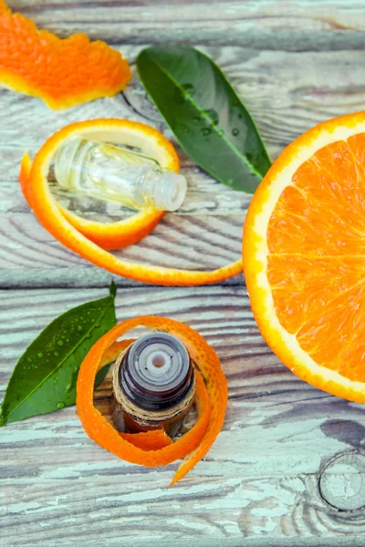 Bottle of orange essential oil for aromatherapy (Extract, tincture, decoction, juice) medicinal properties of orange.