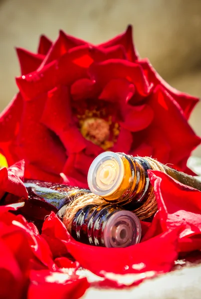 Rose essential oil in a small bottle of dark glass