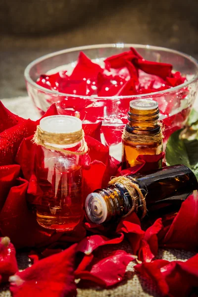 Rose essential oil in a small bottle of dark glass