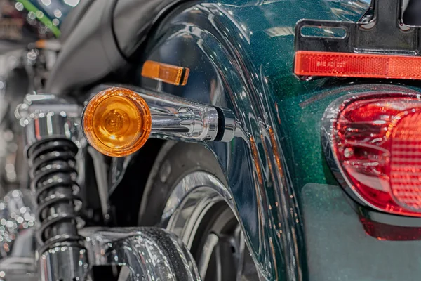 Close up of motorcycle rear light, indoor photo.