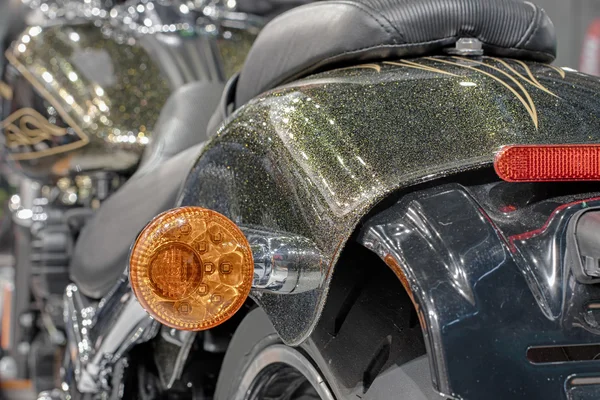 Close up of motorcycle rear light, indoor photo