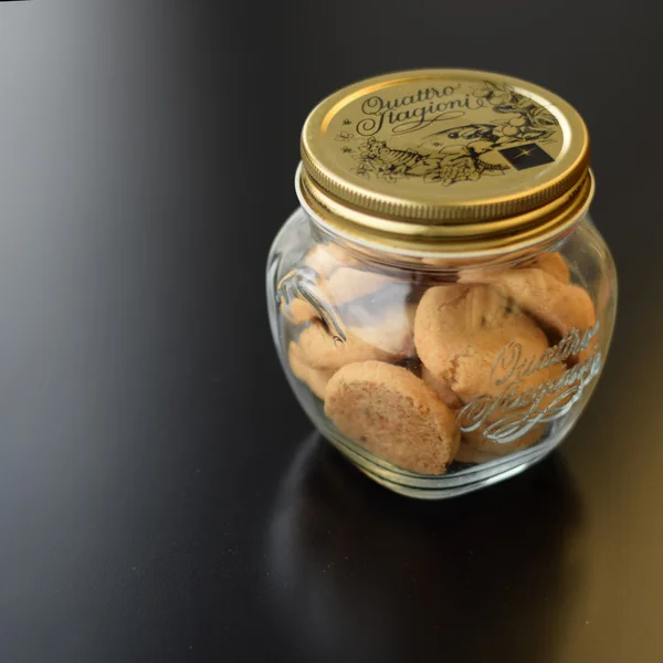 Cookies in glass jar on table