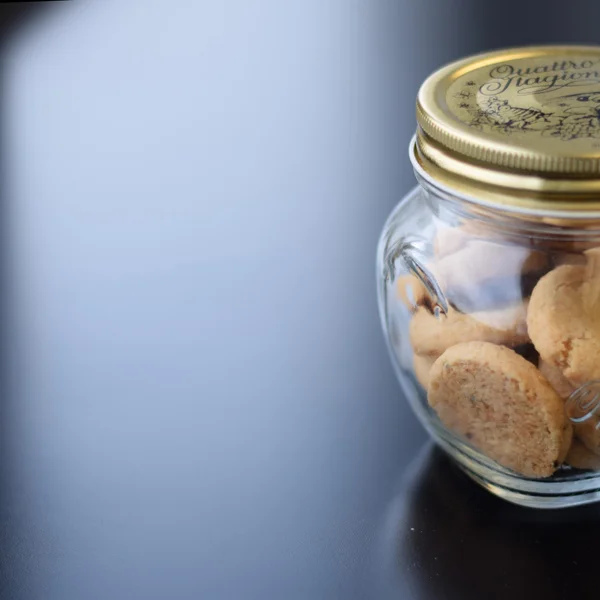 Cookies in glass jar on table