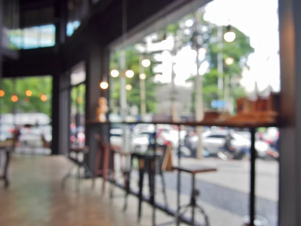 Bar stool beside window in coffee shop, blur background with bokeh