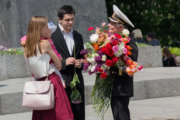 Kiev, Ukraine - May 09, 2016: Citizens congratulate veterans of the Second World War