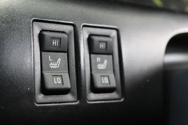 Button heated seats in the car