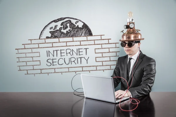 Internet security concept with vintage businessman and laptop