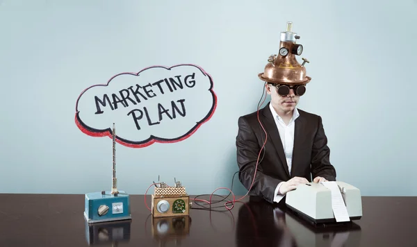 Marketing plan concept with vintage businessman sitting at office desk