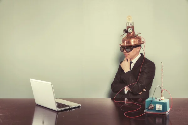 Vintage businessman sitting at office desk