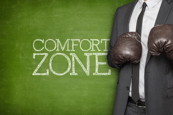 Comfort zone on blackboard with businessman