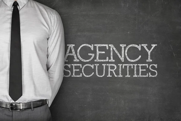 Agency securities text on blackboard