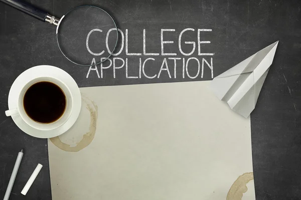 College application concept on black blackboard with empty paper sheet