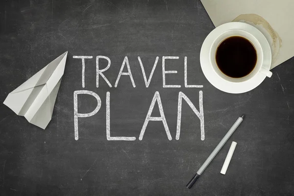 Travel plan concept on blackboard
