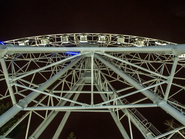 Ferris wheel at night view from below in Ufa, Bashkortostan, Rus