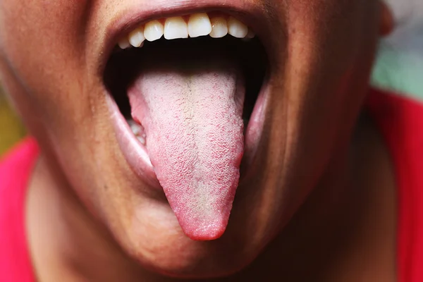 Woman showing the tongue