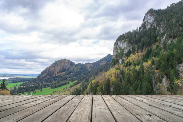 Empty wooden terrace with Austria national park view on background