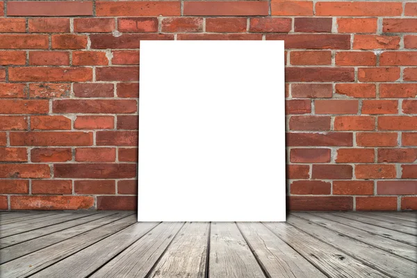 Poster stand on wooden floor with brick wall. You can write some