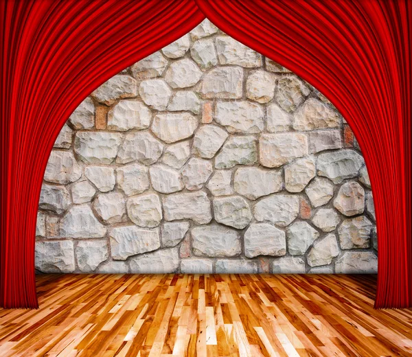 Red curtain in front of rock background with wooden floor, rock
