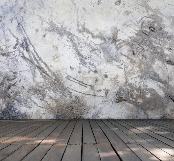 Grungy concrete wall with wood floor