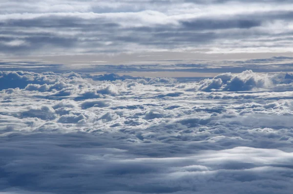 Sea of clouds from airplane window