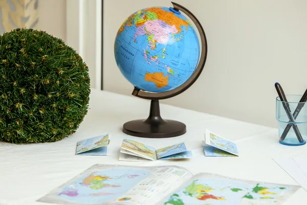 School globe and books on the table