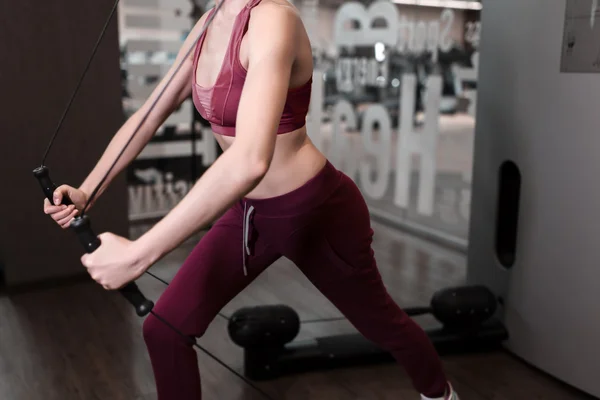 Woman working fitness sport on kinesis technology machine