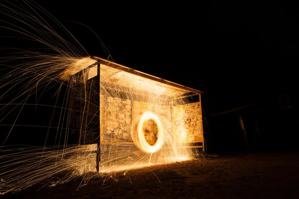 Steel wool spinning, fire shower concept abstract background