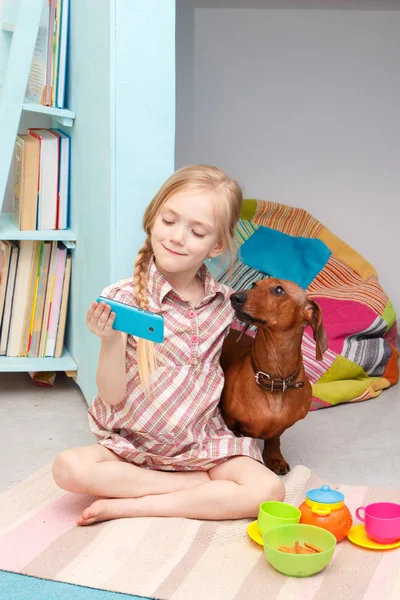 The little girl at the picnic with the dog