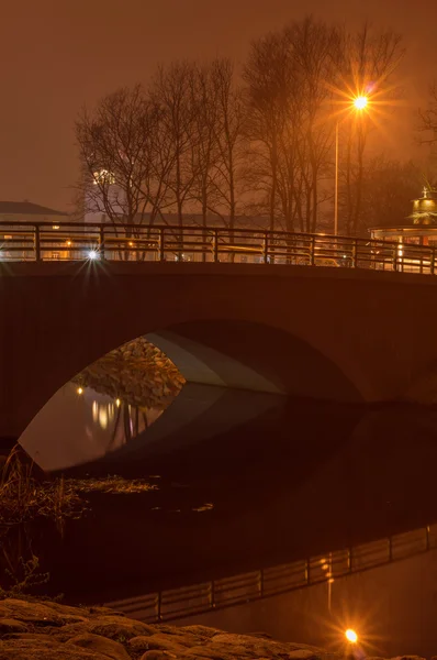 Bridge with reflection in the water at night