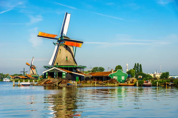 Fully operational historic Dutch Windmills along the Zaan River at the village of Zaanse Schans in the Netherlands