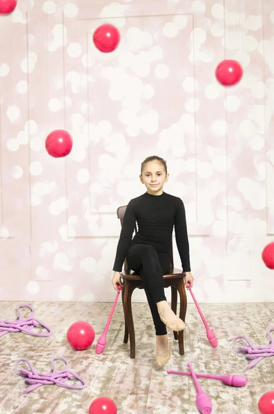 Gymnastic girl with Rhythmic pink clubs