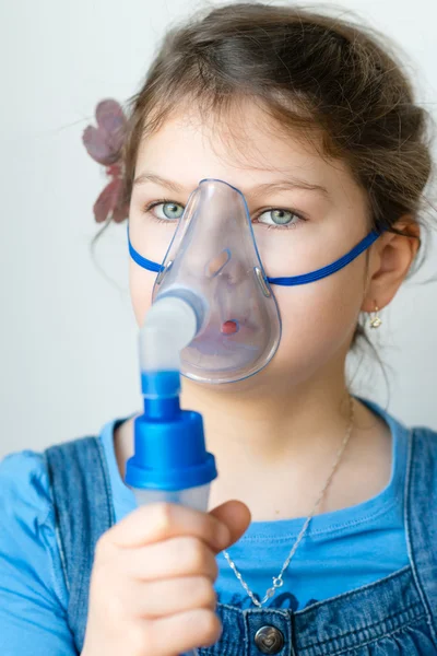 Girl with asthma inhaler