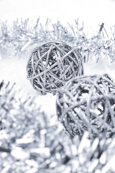 Silver Christmas balls in the snow