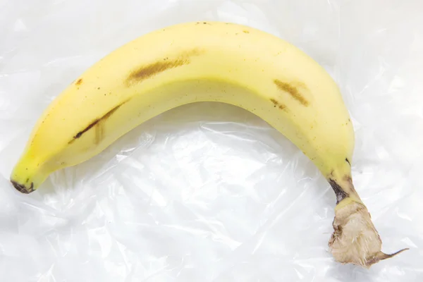 A banana on a plastic bag