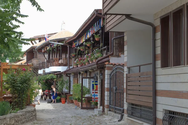 NESSEBAR, BULGARIA, JUNY 18, 2016: The streets of the old city resort of Nessebar in Bulgaria are full of tourist during summer. Old town is famous for its distinctive wooden architecture