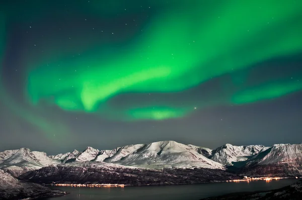 Northern lights above fjords in northern Norway