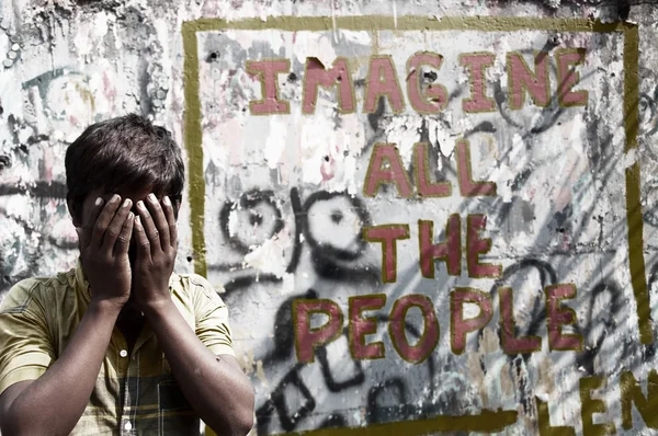 Boy at wall sign, discrimination concept