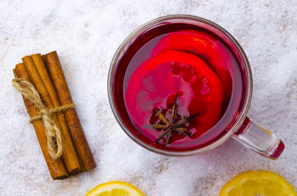 Cup of hot wine on a table