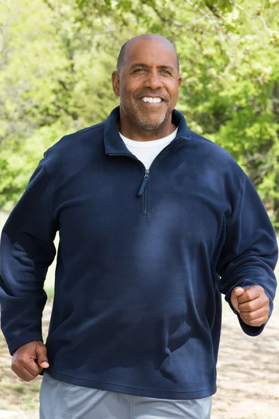 Mature African American man jogging