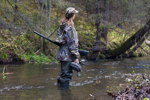 Woman hunter with stuffed duck