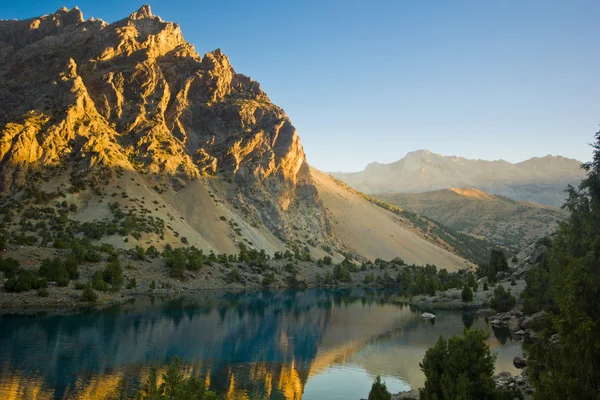 Blue mountain lake at sunrise