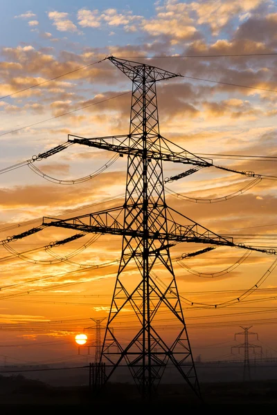 Electrical pylon and high voltage power lines near transformatio