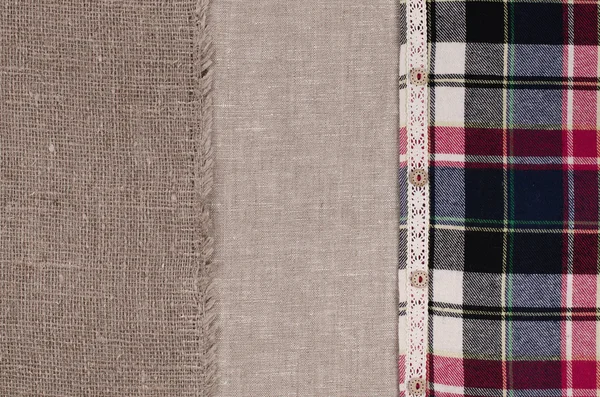 Fabrics background. Linen fabric, sackcloth, plaid flannel shirt