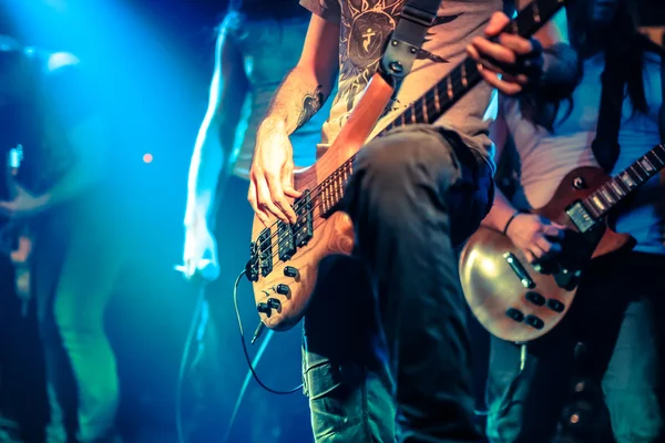 Guitarist playing electrical guitar on a rock gig