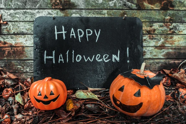 Happy Halloween. Holiday pumpkins and decorations. Pumpkin on autumn street.