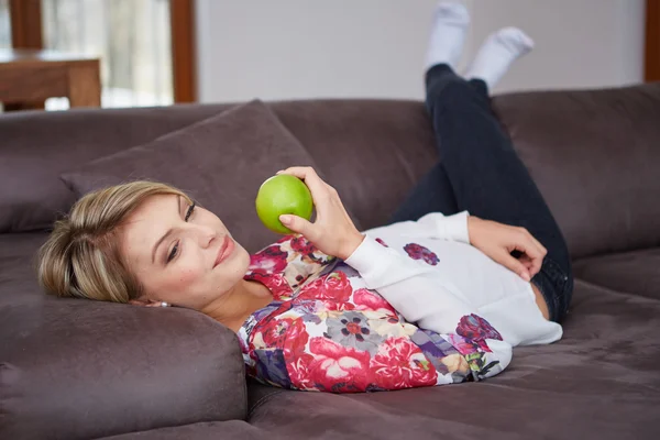 Woman with a apple in her hand