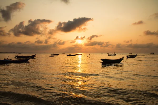 Fishing boats, small boats floating in the sea at sunrise, Conce