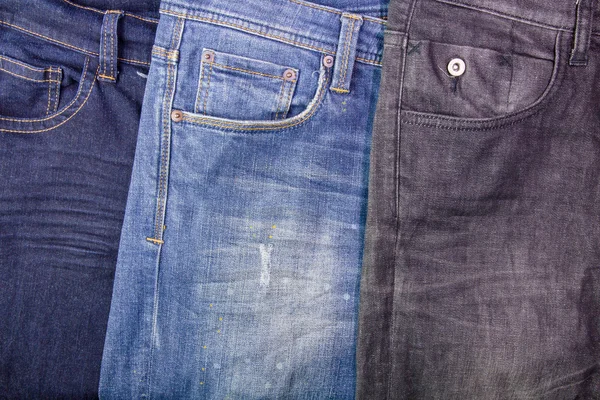 Close up of jeans\'s pile.Background with jeans material