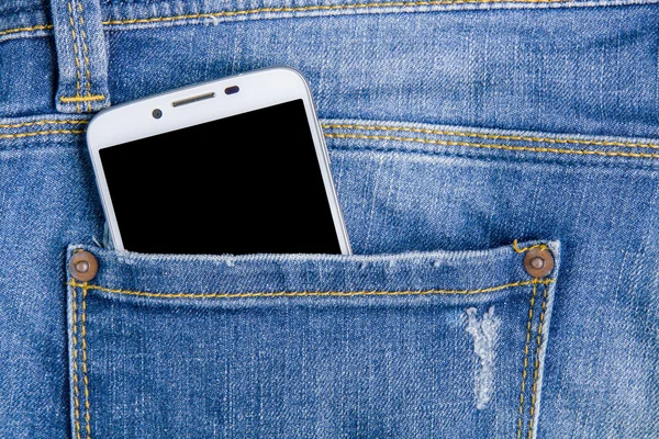 Smart phone in the back pocket jeans.Jeans background.