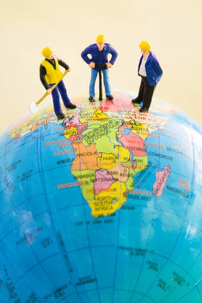 Tiny toy explore the globe world map